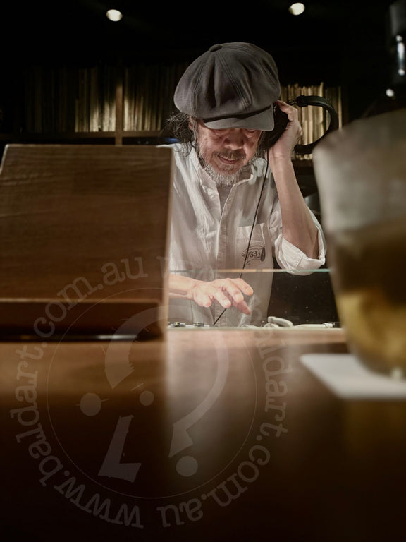 Man working on a wooden surface with a blurred background