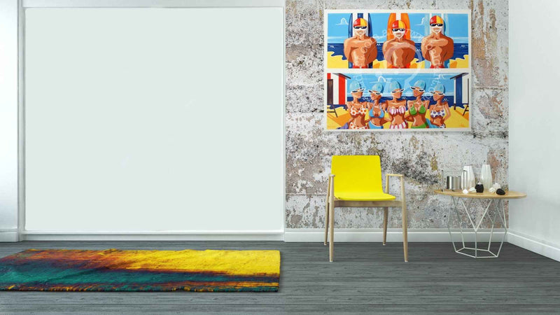 Modern interior with a yellow chair, small table, and colorful rug.