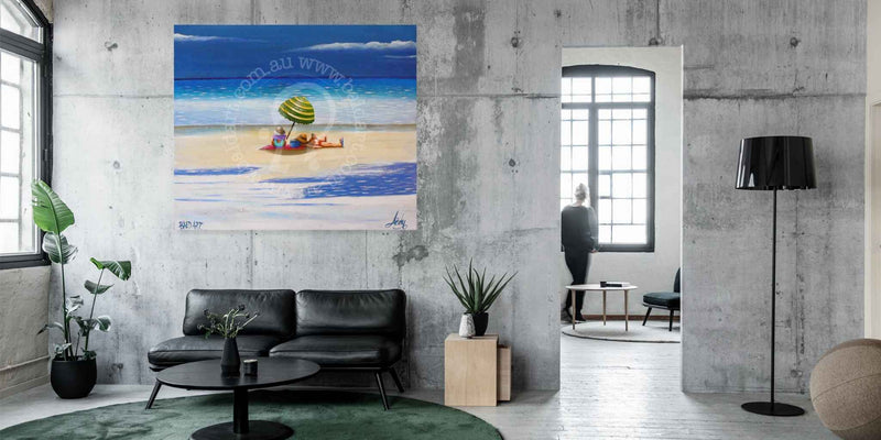 Beach scene painting on a wall in a modern living room.