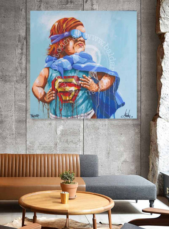Painting of a superhero character holding a Superman logo on a wall in a living room.