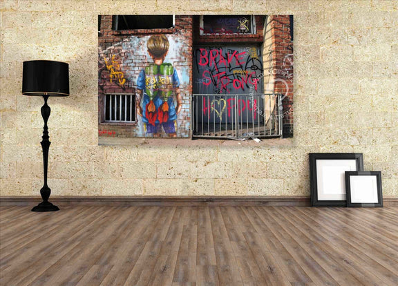 Room interior with a large wall art piece depicting a person looking at graffiti.