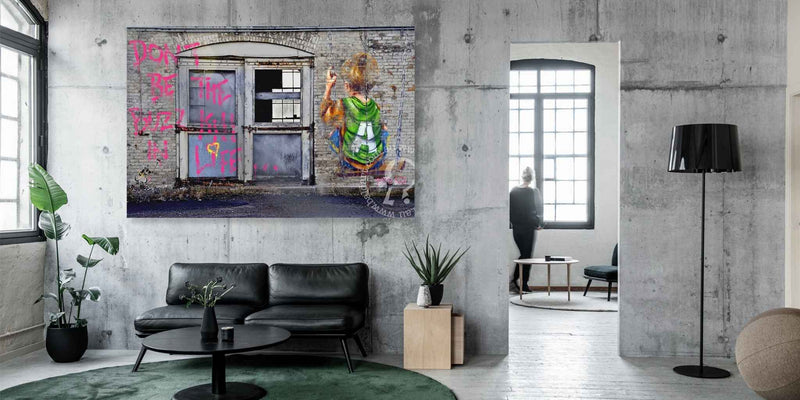 Modern living room with a large abstract painting on the wall.