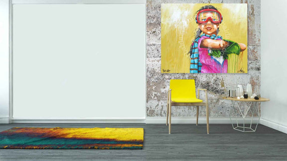 Room interior with a colorful painting of a child, yellow chair, and small table.