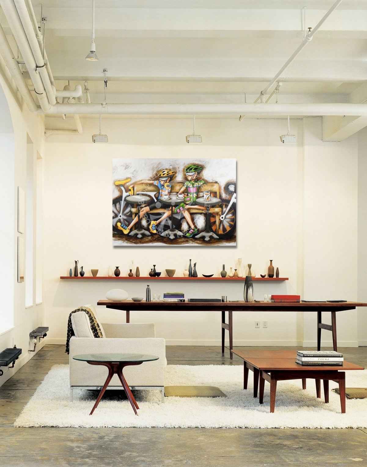 Modern office interior with a large painting on the wall, desk, and chairs.