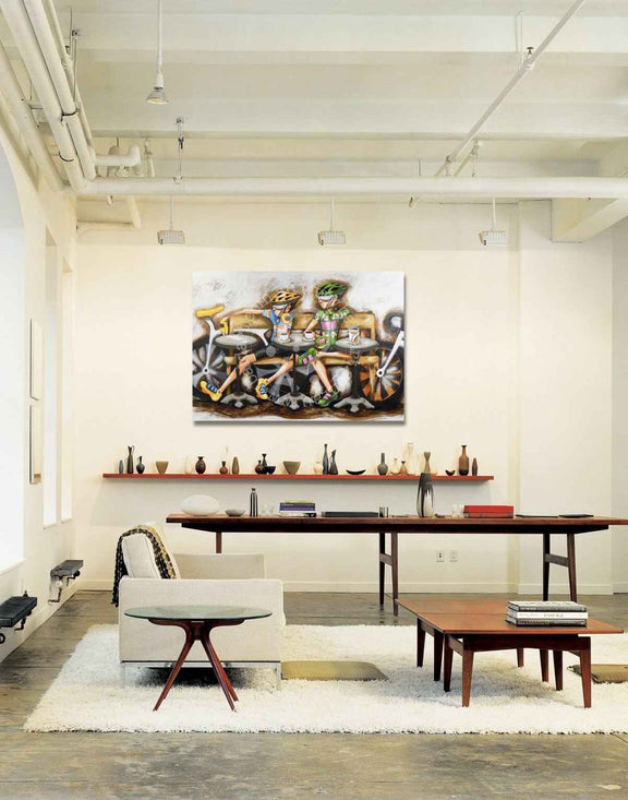 Modern office interior with a large painting on the wall, desk, and chairs.