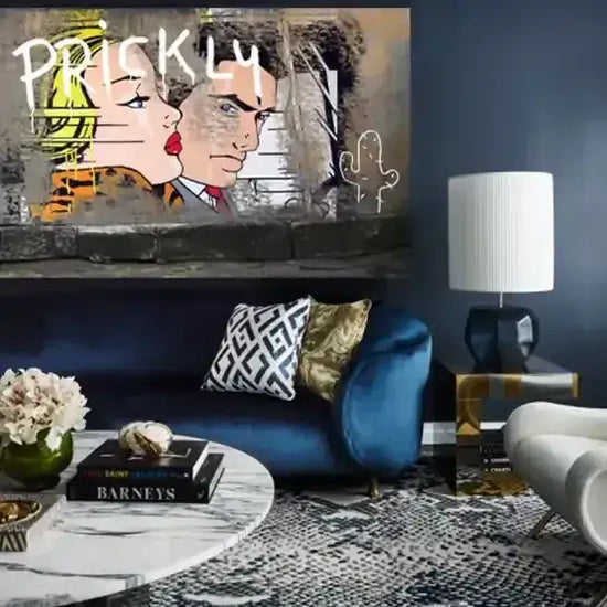 Modern living room with blue sofa, decorative pillows, and a painting on the wall.