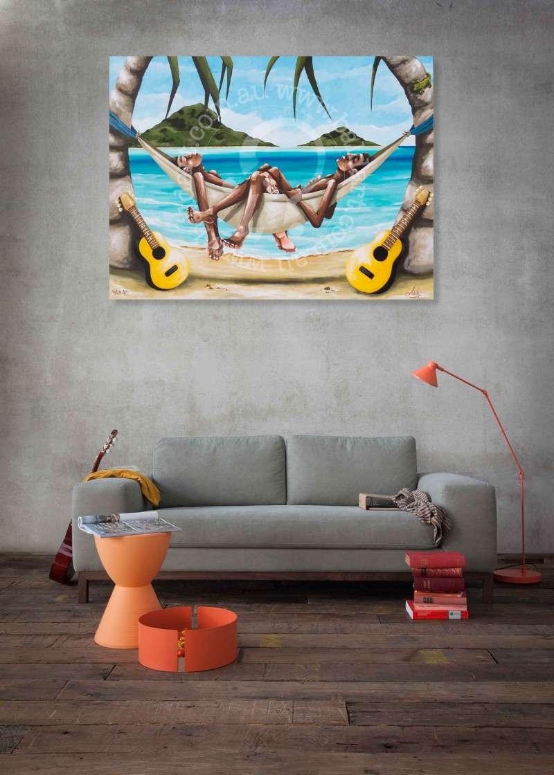 Living room with a painting of people in a hammock on a beach, gray sofa, and orange stool.