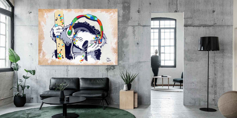 Modern living room with a large abstract painting on the wall.