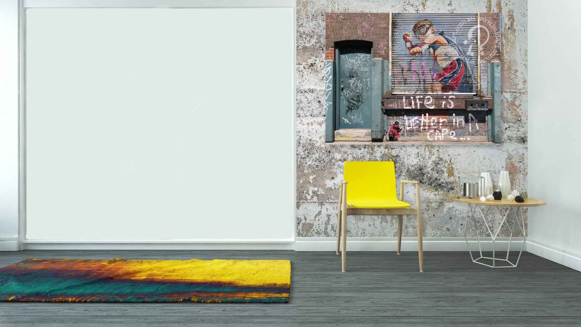 Modern interior with a yellow chair, colorful rug, and wall art.