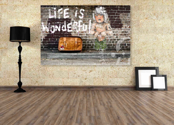 Room interior with a large wall art piece featuring a child and text, a lamp, and picture frames.