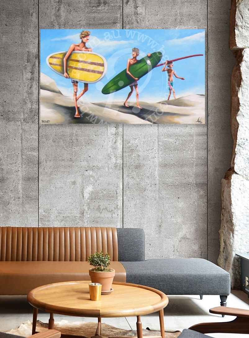 Three people with surfboards on a beach scene painting above a modern living room setup.