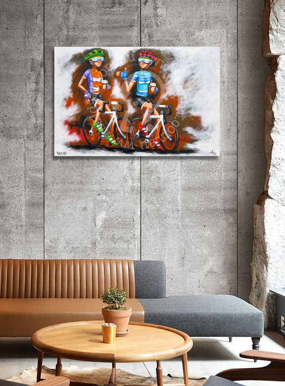 Colorful abstract painting of cyclists on a wall above a sofa and coffee table.