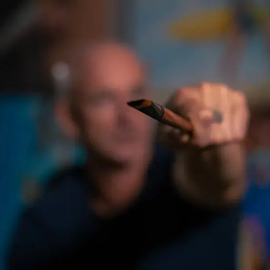 Blurred image of a person holding a smartphone with a blurred background