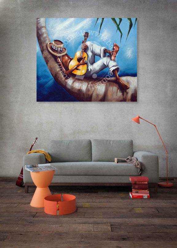 Living room with a large painting of a person playing guitar on a palm tree, gray sofa, and orange lamp.