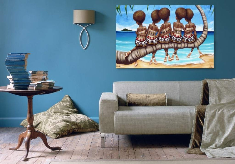 Living room with a gray sofa, small table, and wall art of people on a boat.