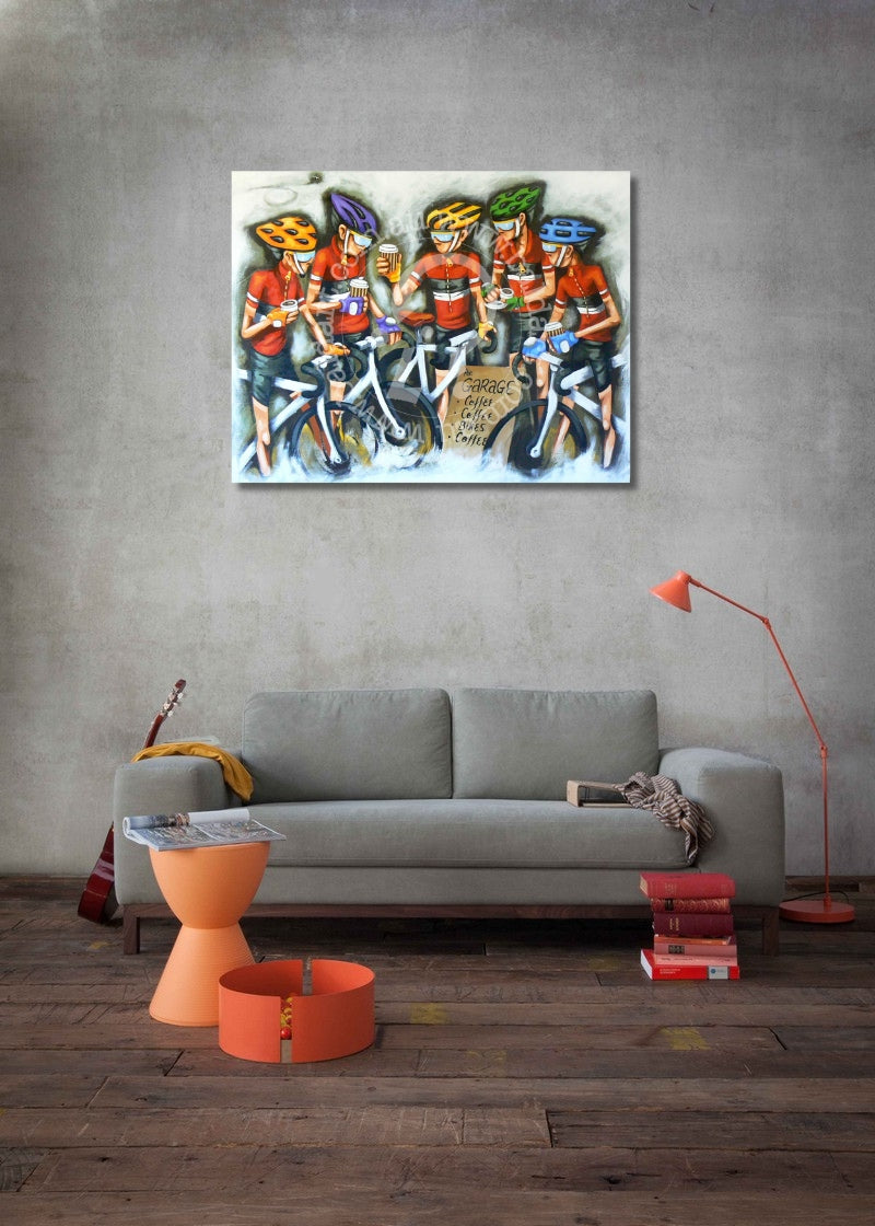 Living room with a gray sofa, orange coffee table, and colorful painting of cyclists on the wall.