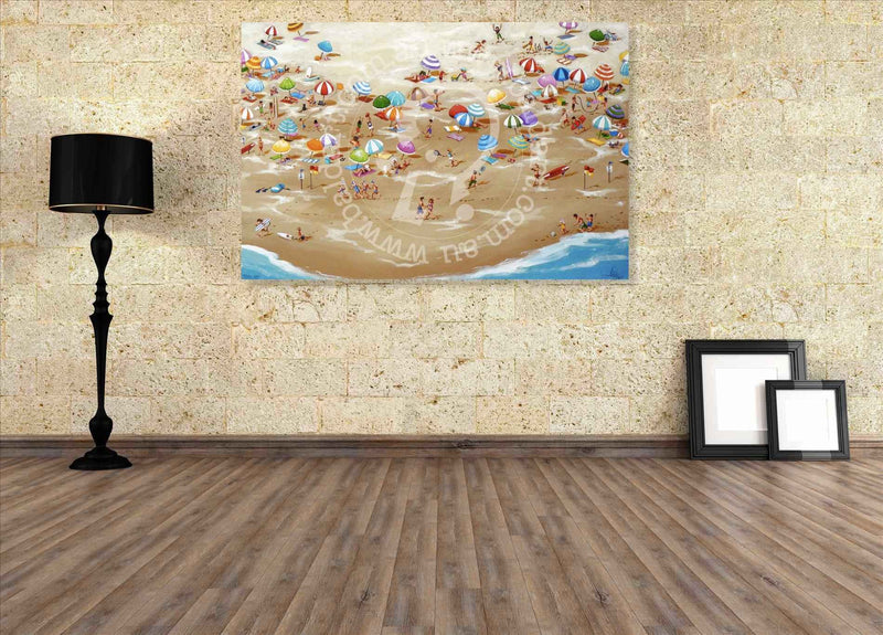 Beach-themed wall art in a room with wooden floor and lamp.