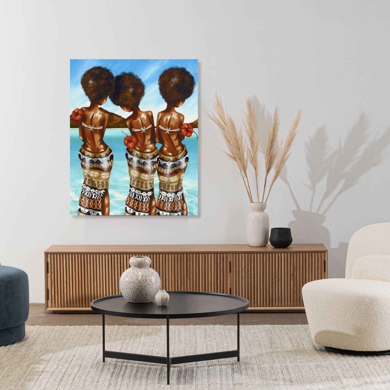 Living room with a painting of three women on the wall, a coffee table, and decorative items.