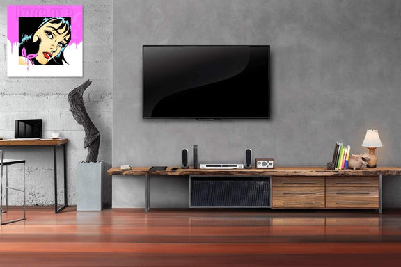 Modern living room with a television mounted on the wall, wooden entertainment console, and decorative items.