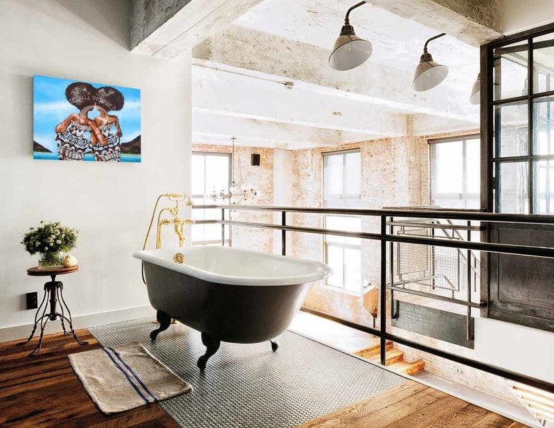 Modern bathroom with freestanding bathtub, large windows, and decorative elements.