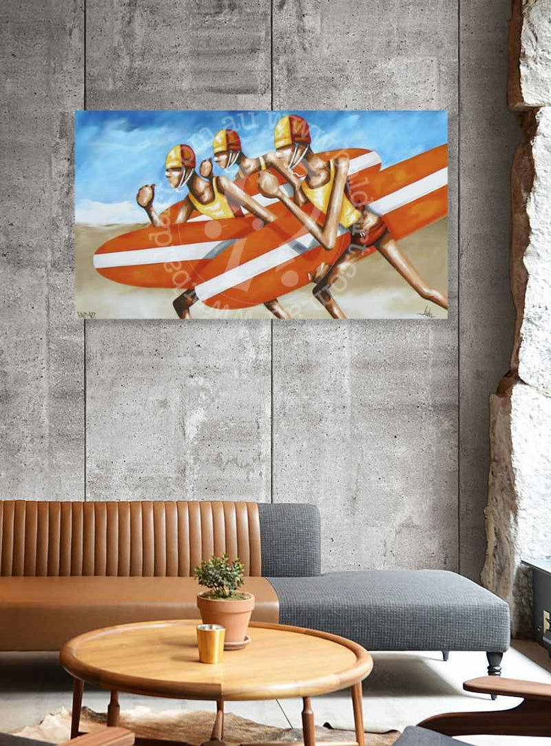 Painting of surfers on a wall above a living room with a couch and coffee table.