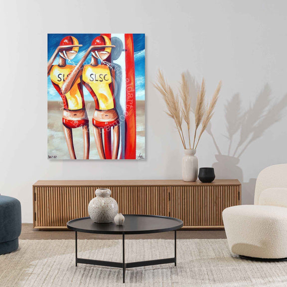Colorful painting of two lifeguards on a wall in a modern living room.