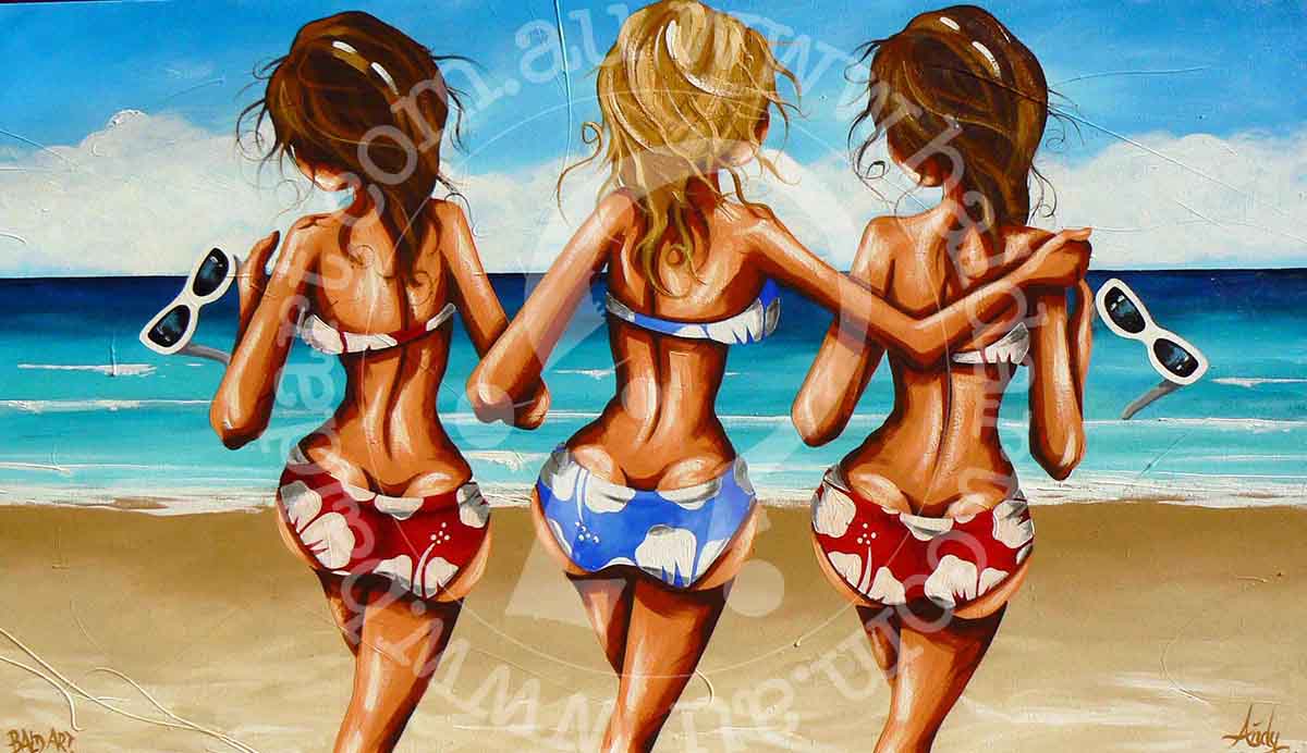 Three girls happily painting on the beach, surrounded by sand and waves, enjoying a sunny day together.