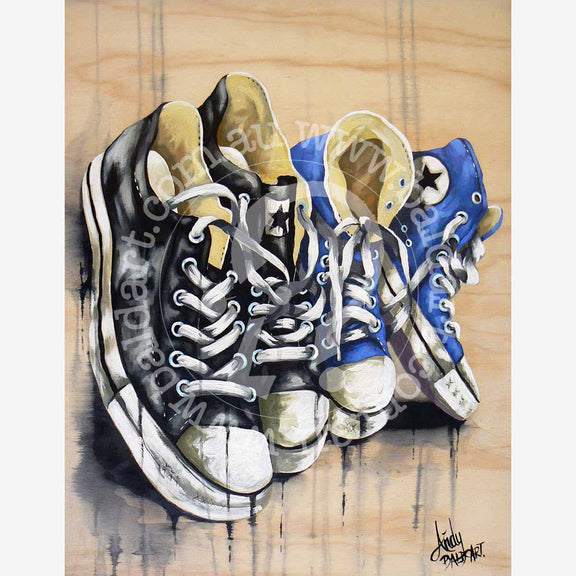 A canvas artwork featuring a pair of blue and black sneakers.