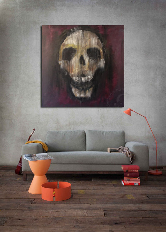 A skull painted on a deep red background, creating a dramatic visual effect with strong color contrast.