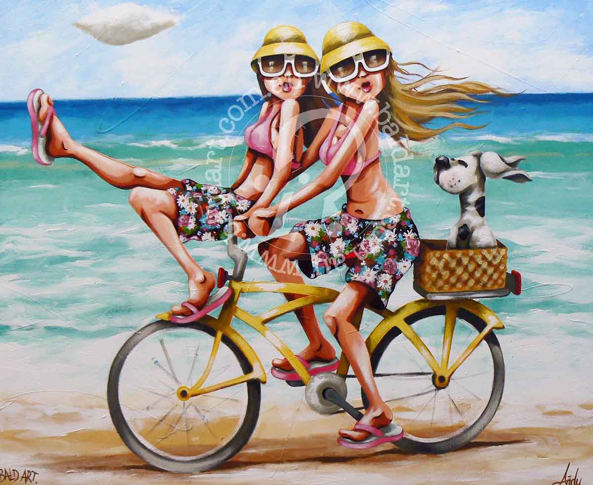 Two women ride a bike along the beach, happily accompanied by a playful dog running beside them.