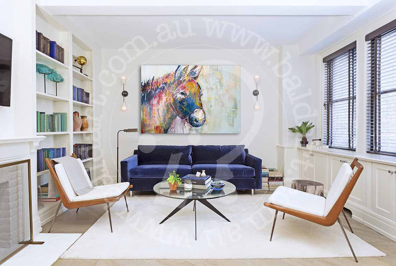 A living room showcasing a blue couch and a horse painting, blending comfort with artistic decor.