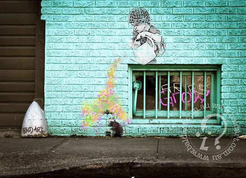 Artistic graffiti depicting a cat on a wall, blending urban aesthetics with playful imagery.