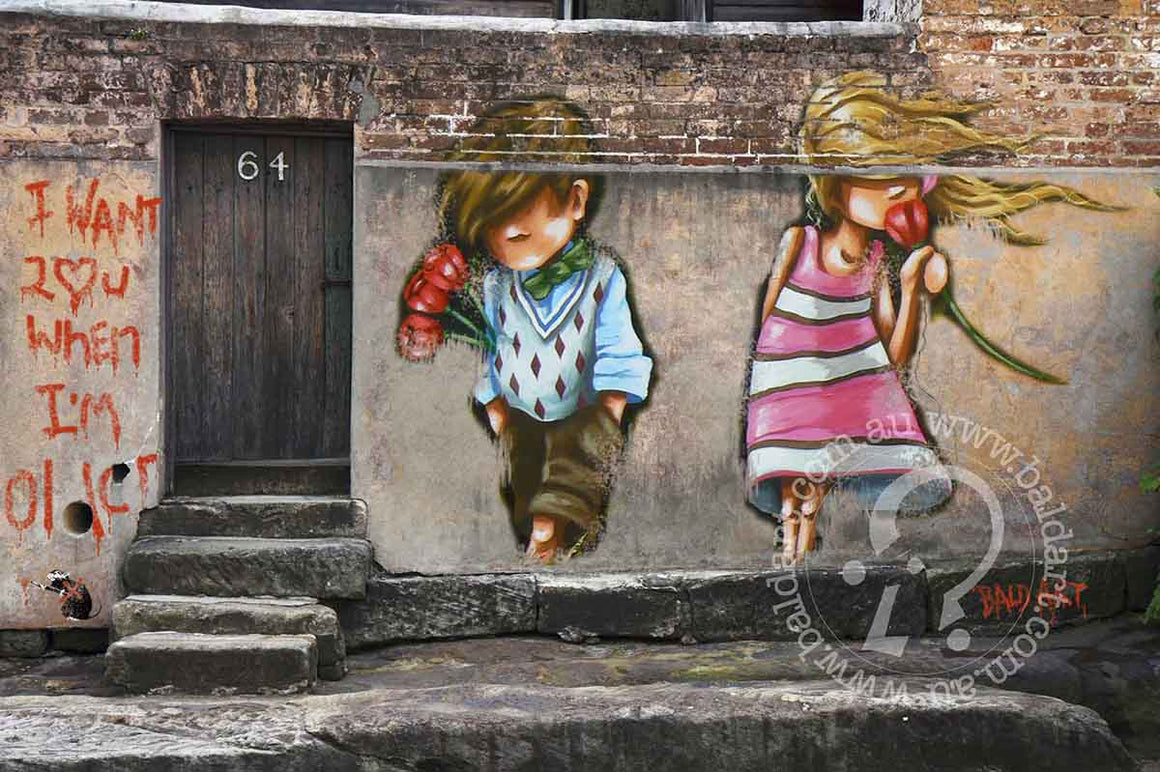 A graffiti-style artwork on a wall featuring two stylized characters, one holding a red flower, the other a green apple, with a 'For Sale' sign on the side.