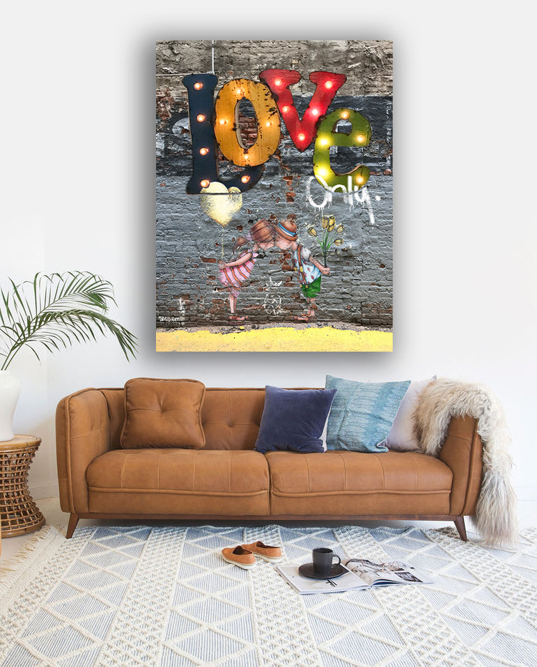 A modern living room showcasing a couch and an eye-catching painting of the word "love" as a focal point.