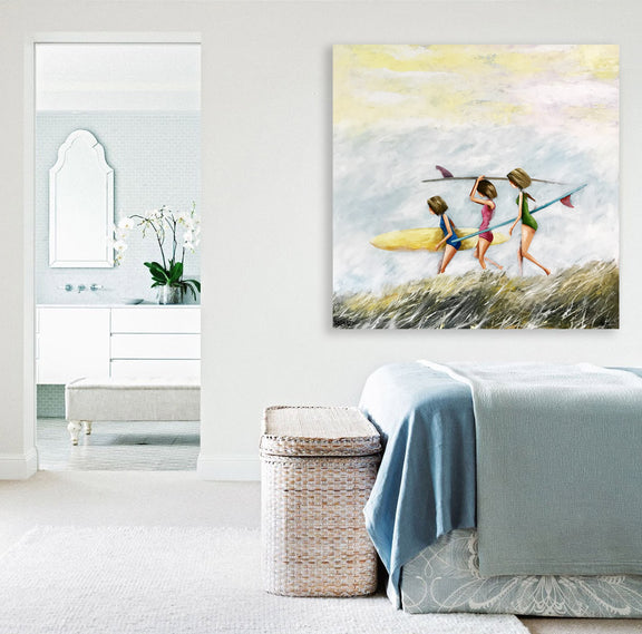 A colorful painting of three women walking on the beach, each holding a surfboard, with waves gently crashing in the background.