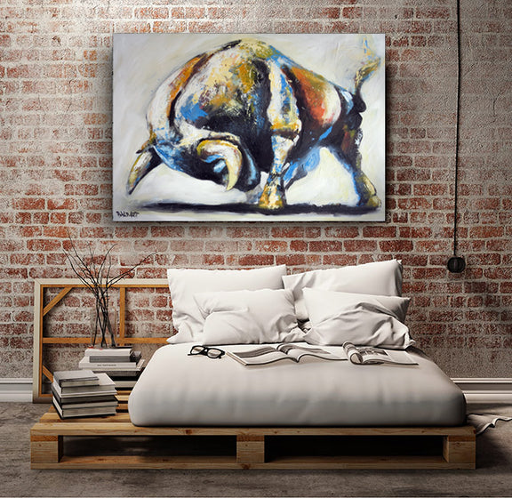 A vibrant bull painting adorns the wall of a bedroom, enhancing the room's artistic ambiance.