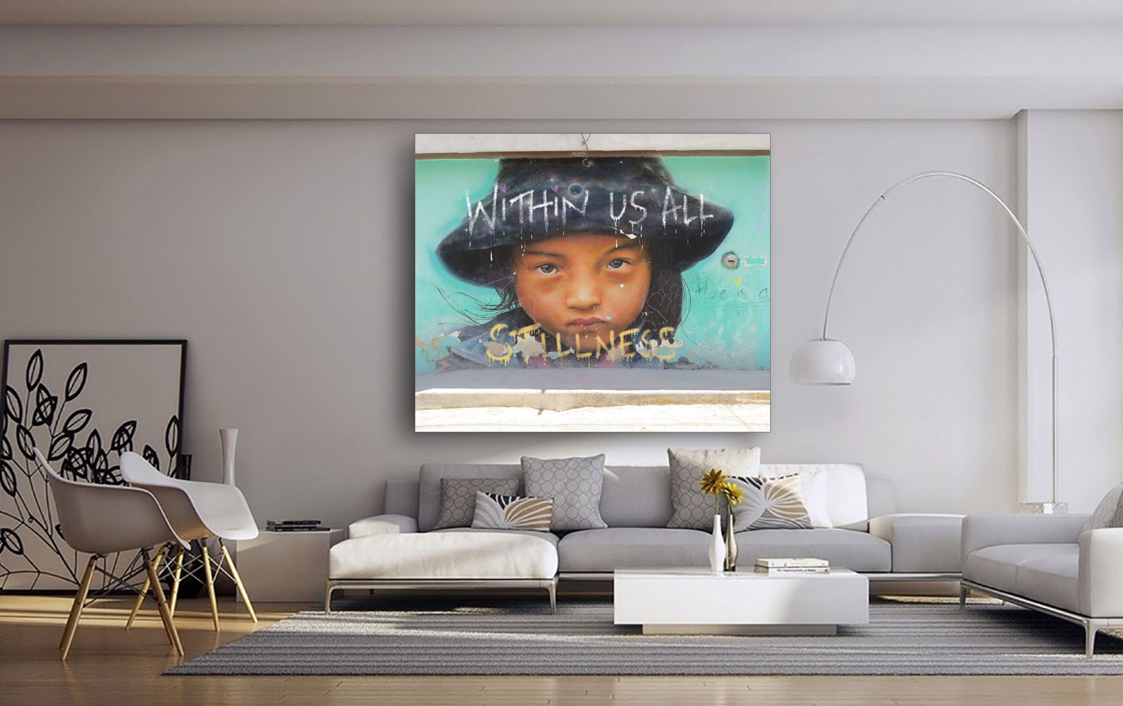 A canvas wall art featuring a stylized urban scene with text and a figure, displayed above a modern sofa setup in a minimalist interior.