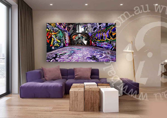 A purple couch against a purple wall adorned with vibrant graffiti art, creating a bold and artistic atmosphere.